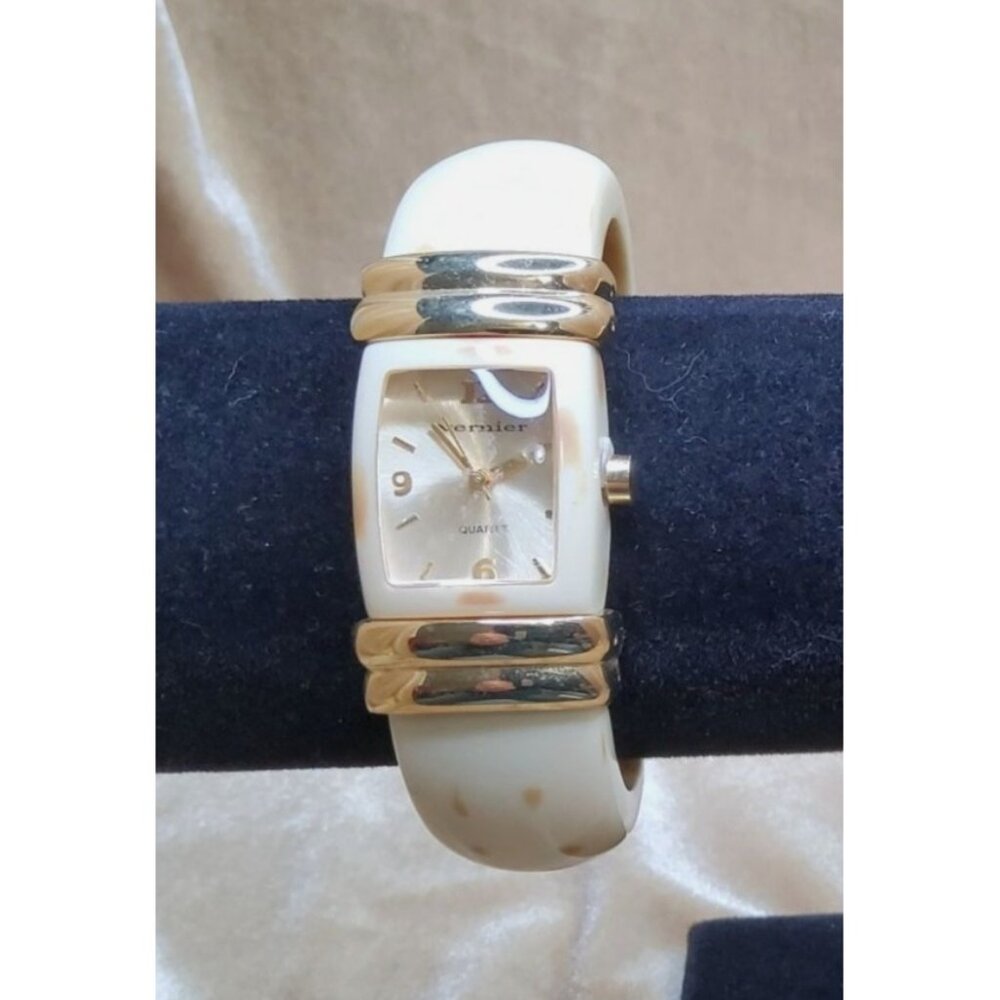 Vintage Vernier quartz fashion watch featuring goldtone, lucite cuff in beige an